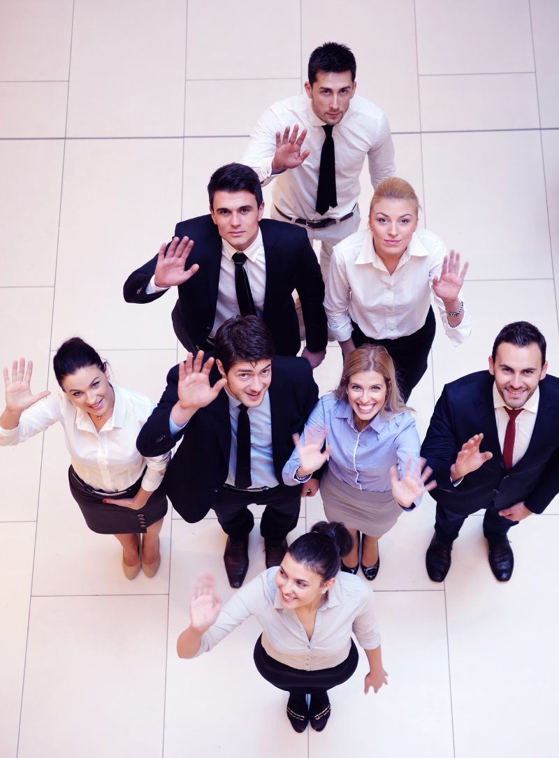 business people group joining hands and stay as team in circle and representing concept of friendship and teamwork<br />
